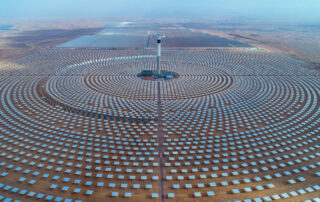 Morocco: The Noor Ouarzazate solar complex, located in the Sahara Desert. Featured in Solar Adoption Across Africa.